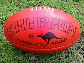 Photo of AFL football on grass