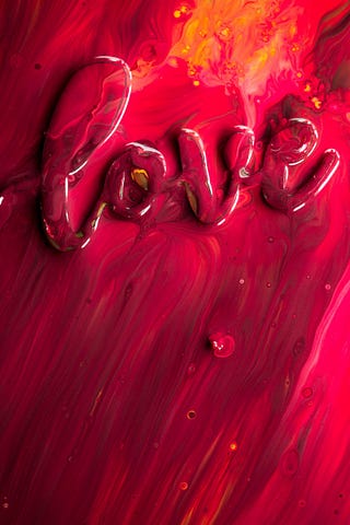 The word Love in red in 3D format