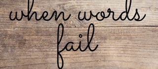 The words “When words fail” written on a wood backdrop