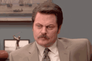 A gif of Ron Swanson from the sitcom Parks and Recreation sighing.