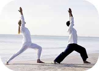 Two People are practicing Yoga and Tai Chi in the nature.