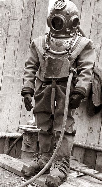 Diver in standard diving dress, Ožbalt, Slovenia (1958) [https://en.wikipedia.org/wiki/File:Gradbi%C5%A1%C4%8De_hidroelektrarne_O%C5%BEbalt_1958,_potaplja%C4%8D.jpg]