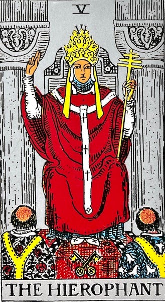 The Hierophant — A pope or priest sits on a chair giving a sermon or a benediction