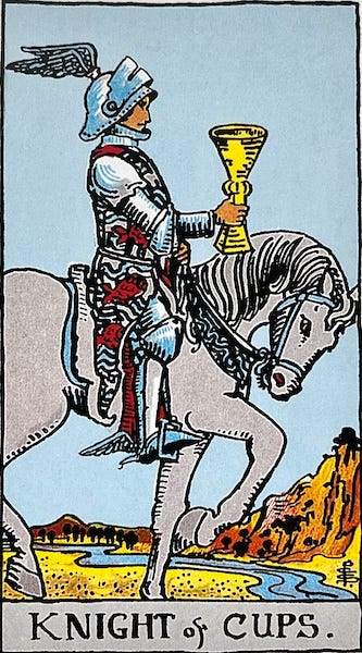 The Knight of Cups — A knight rides on a grey horse holding a cup in his hand.
