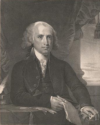 James Madison sitting at table with documents