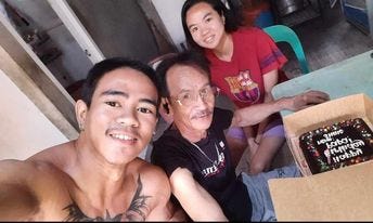 Eljay, together with his father, and youngest sibling.