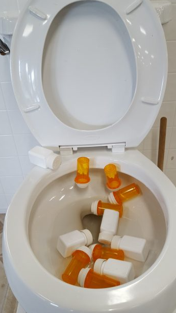 Throwing drugs down the toilet