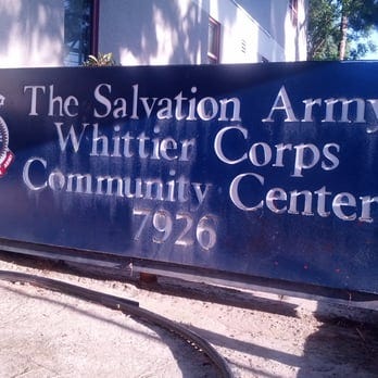 Photo of a blue sign with white text that reads “The Salvation Army Whittier Corps Community Center 7926”