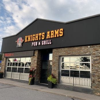 Image of the Knights Arms Pub & Grill, Newmarket Ontario — front door and windows leading onto a outdoor terrace