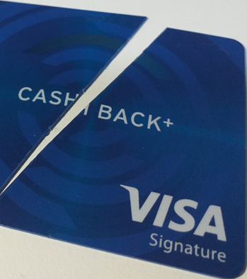 A cashback credit card being cut in two