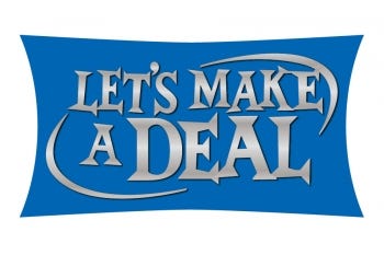 A sign saying “Let’s Make a Deal”.