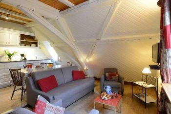 Small but cosy lounge room in a medieval period house in Ribeauville France
