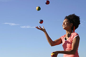 Woman juggling balls