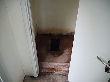 A rectangular hole in the ground