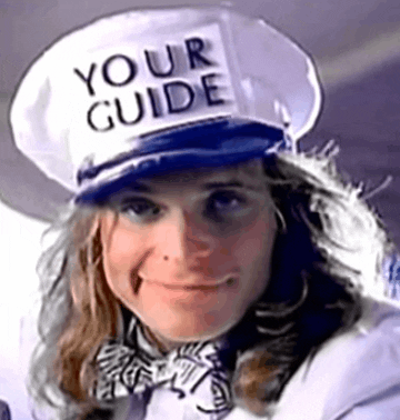 David Lee Roth is wearing a white peaked uniform had that says Your Guide and his making eyes at you.