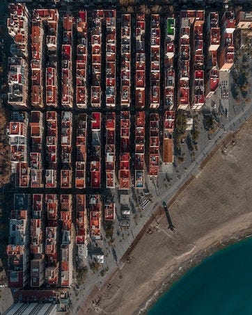 Photo by Leon Macapagal: https://www.pexels.com/photo/aerial-view-of-city-buildings-beside-water-6622898/