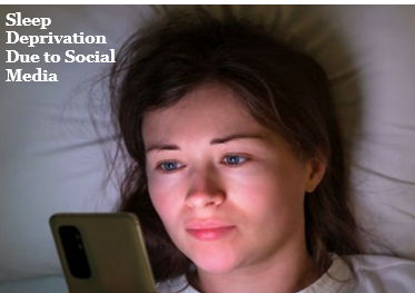 A young lady scrolling through her phone, in the night, lying on her bed.