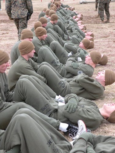 Candidates doing crunches on their PFT