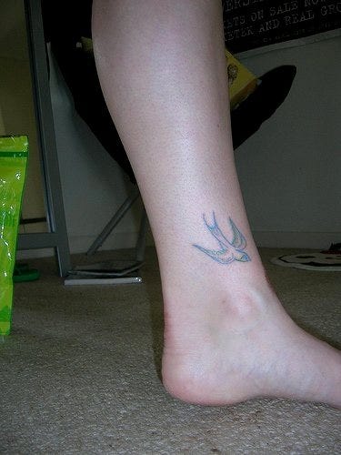 1140 ankle tattoo