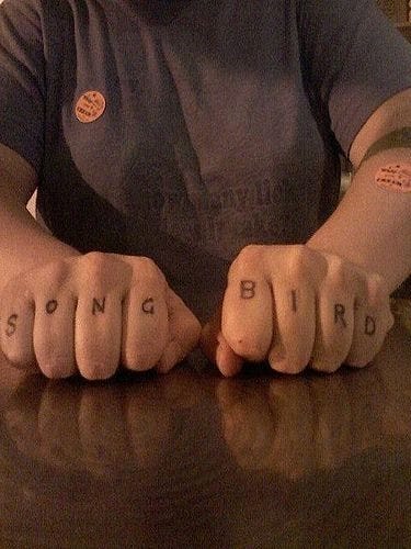 560 written text tattoo