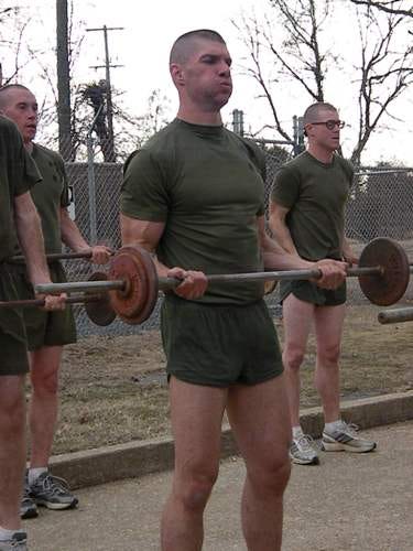 Candidates do curls on the run course