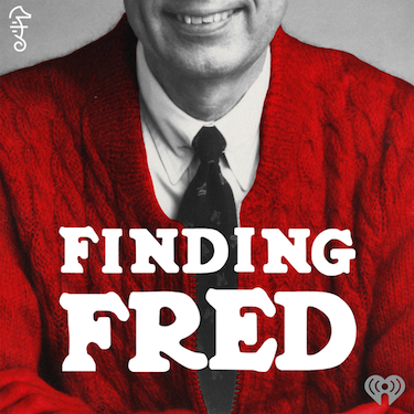 In front of a grey background, Fred Rogers and his famous red cardigan sit. The podcast title is written in white over him
