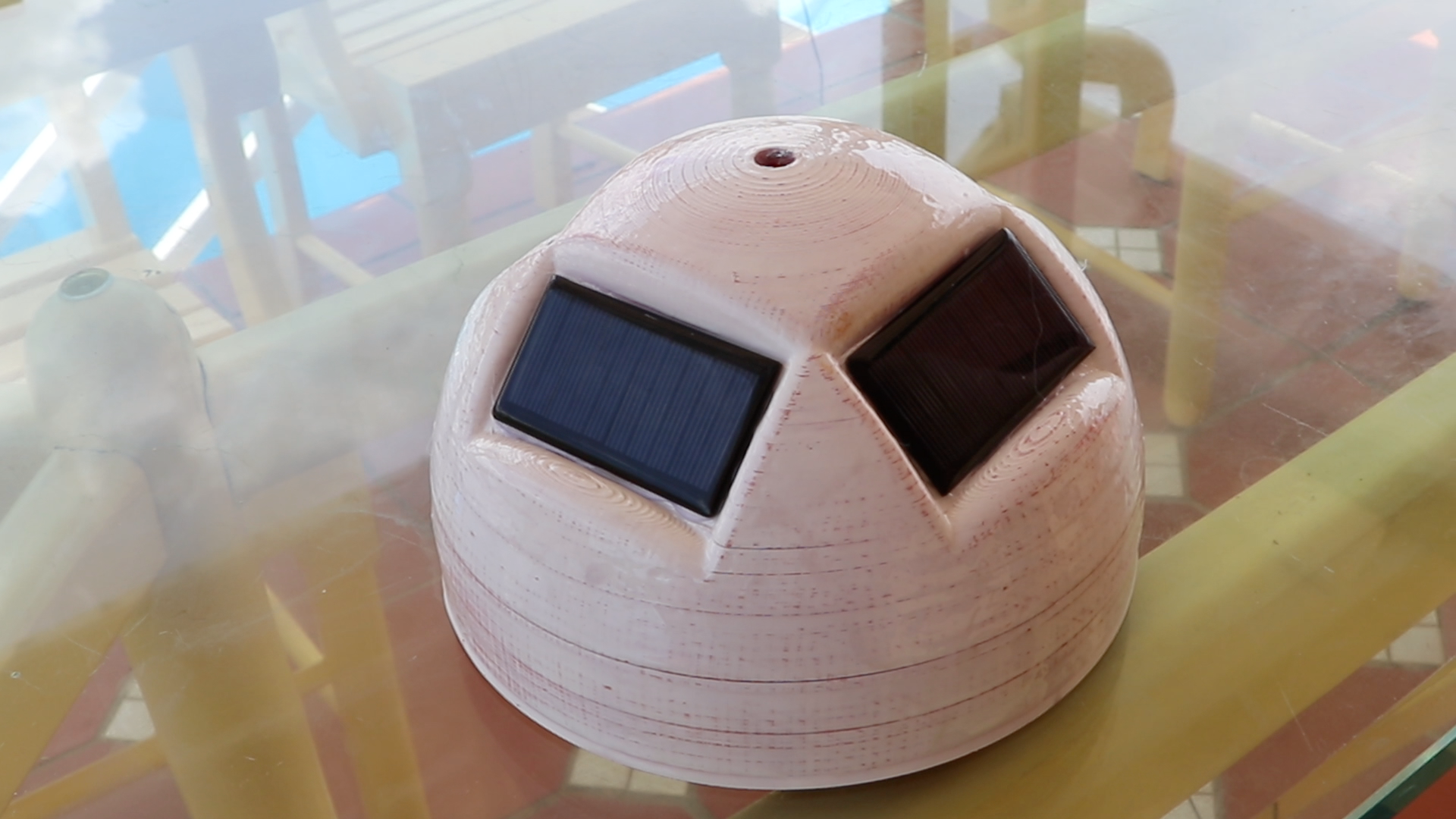 Epoxy covered top half of Buoy with solar panels