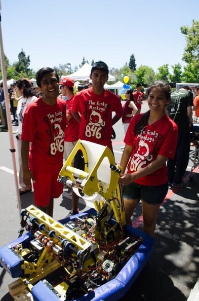 Shikhar Jagadeesh, Ria Pradeep, and Aayush Shah pose behind Monkey Python.