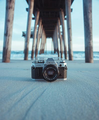 Camera under a pier on a beach