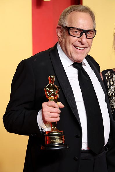 Movie Producer Charles Roven on the Oscar’s Red Carpet wearing retro UV-blocking glasses after cataract surgery.