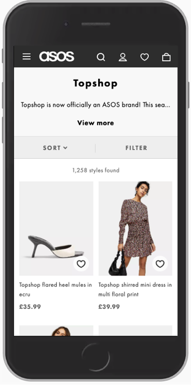 An iPhone with the ASOS website open on the Topshop PLP category page.
