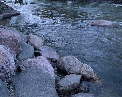 River flowing by large rocks.