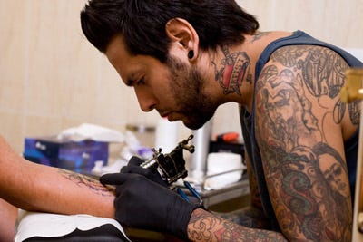 Image result for image man getting tattoo -stock