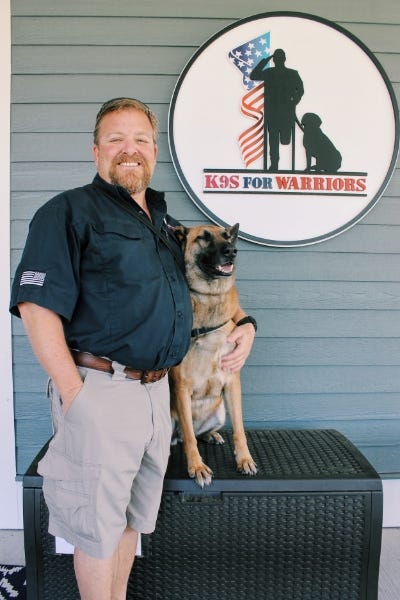 Brett Simon and his service dog.