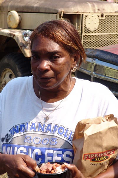 Katrina survivor with donated food.