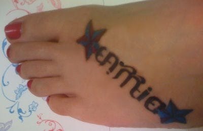 written text Tattoo 555