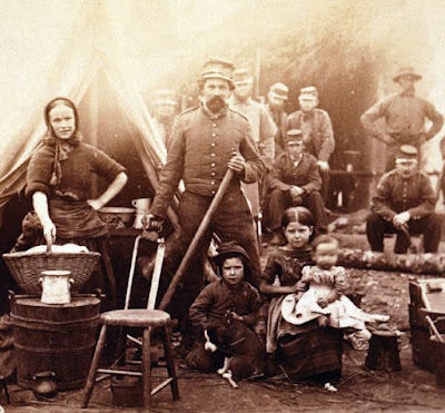 Civil War soldiers and families at camp