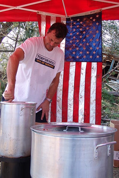 Firehouse Subs co-founder Chris Sorensen prepares food that will be served to survivors of Hurricane Katrina. 