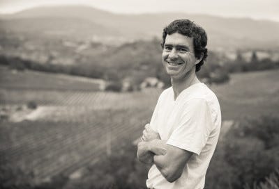 Michael posing for a photo in family vineyard