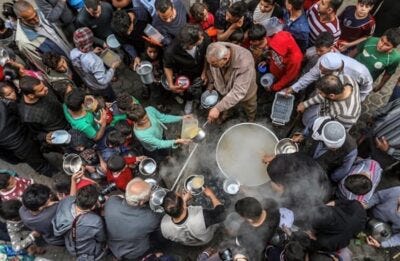 Soup distribution during the Islamic holy month of Ramadan in Gaza City in April 2020, amid the COVID-19 pandemic. Photo credit: Mohammed Zaanoun, independent Palestinian photo journalist based in Gaza. Instagram @m.z.gaza