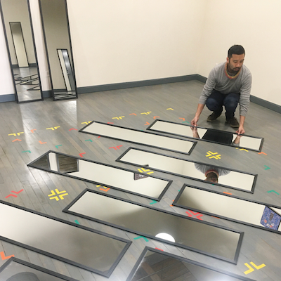 The artist Jeffrey Augustine Songco installs his installation artwork called “Spike Mark and Mirrors” at FLXST Contemporary.