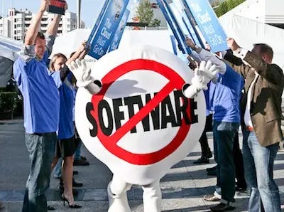 An “end of software” mascot surrounding by people pretending to protest traditional enterprise software.