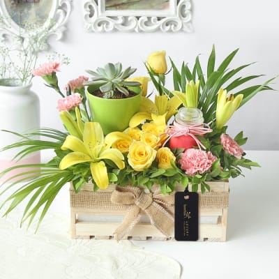 Flower and plants in the wooden tray