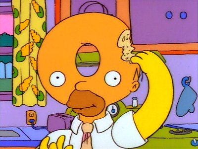 Homer comiendo su cabeza hecha de rosquilla