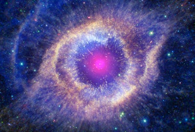 Helix Nebula, courtesy NASA; contains IR data from NASA’s Spitzer Space Telescope (green and red), optical light from Hubble (orange and blue), UV from NASA’s Galaxy Evolution Explorer (cyan), and Chandra’s X-rays (appearing as white) showing the white dwarf star that formed in the center of the nebula. Image is about 4 light years across. Image credit: X-ray: NASA/CXC; Ultraviolet: NASA/JPL-Caltech/SSC; Optical: NASA/STScI (M. Meixner)/ESA/NRAO (T.A. Rector); Infrared: NASA/JPL-Caltech/K. Su)