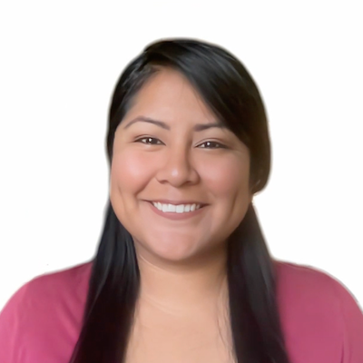 Photo of Xochitl, a Latina woman, from the chest up. She is looking at the camera with an open-mouthed smile. She is wearing a dark pink top. Her black hair is down.