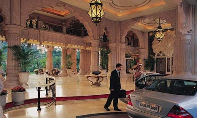 Photo of the Leela Palace Bangalore outdoor reception lobby. Wow.