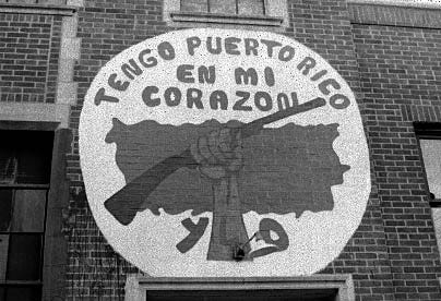 Young Lords logo on a building wall, December 27, 2003