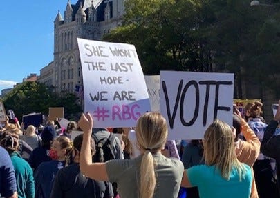 Sign reading “She wasn’t the last hope — we are. #RBG”.