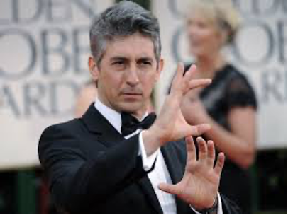 Alexander Payne, Academy Award-winning Director, at the Golden Globes posing for a picture.